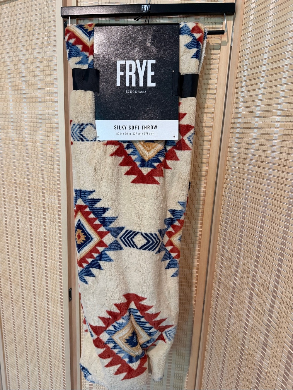 FRYE Cream Throw with Red and Blue Geometric Pattern